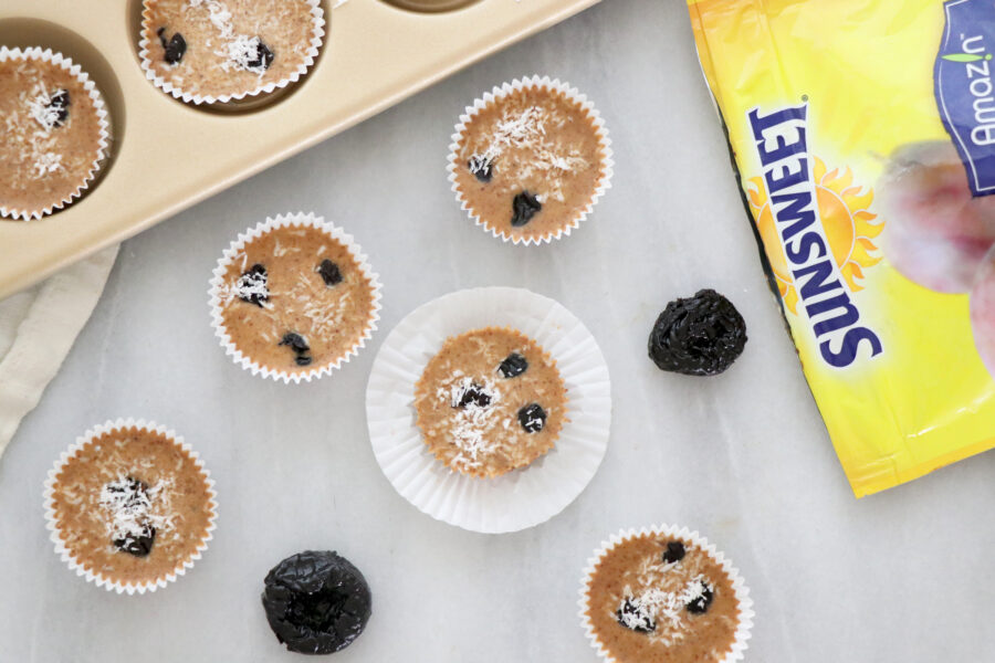 Prune cups on the counter with Sunsweet package on the right side.