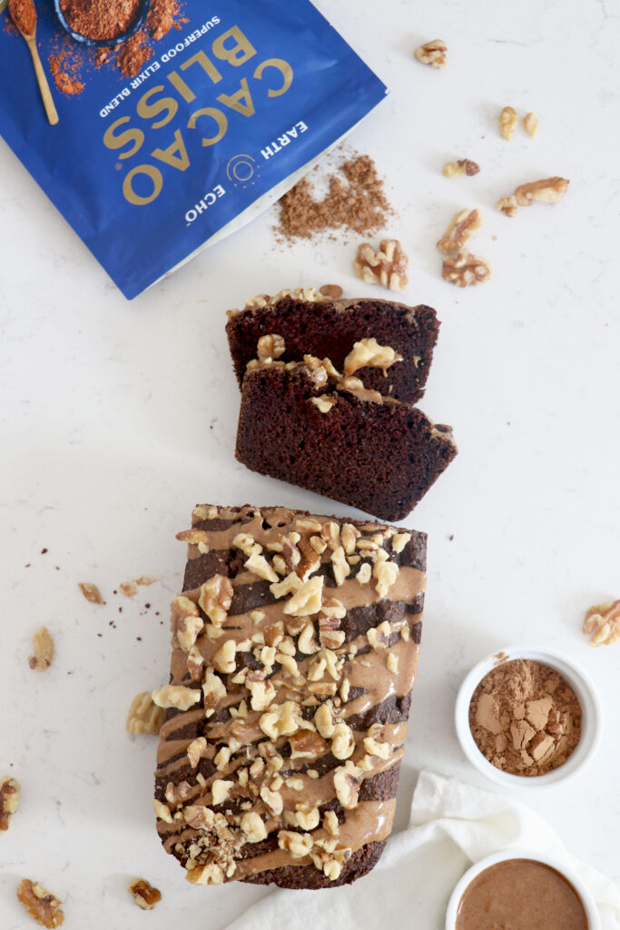 Almond flour cacao bread with walnuts on top and cacao bliss package up top.