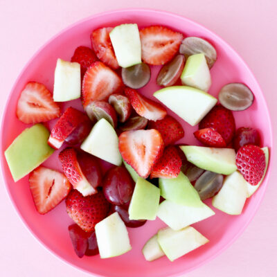 Fruit salad on pink plate