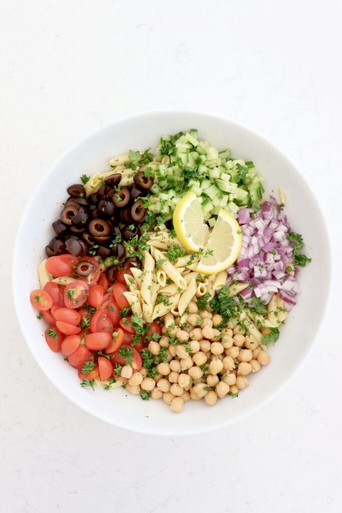 Chickpea pasta salad with diced veggies and lemon dressing.