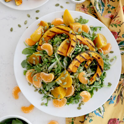 Fall salad topped with kabocha squash, golden beets and orange segments