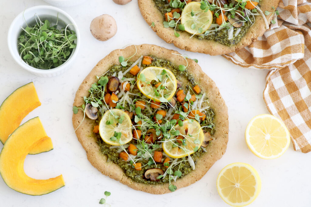 pizza with pesto, sprouts, mushrooms, squash and lemons.