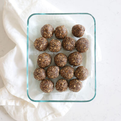 Round brown molasses snack bites in glass food container