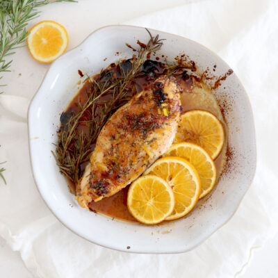 Large baked chicken breast glazed with orange and honey